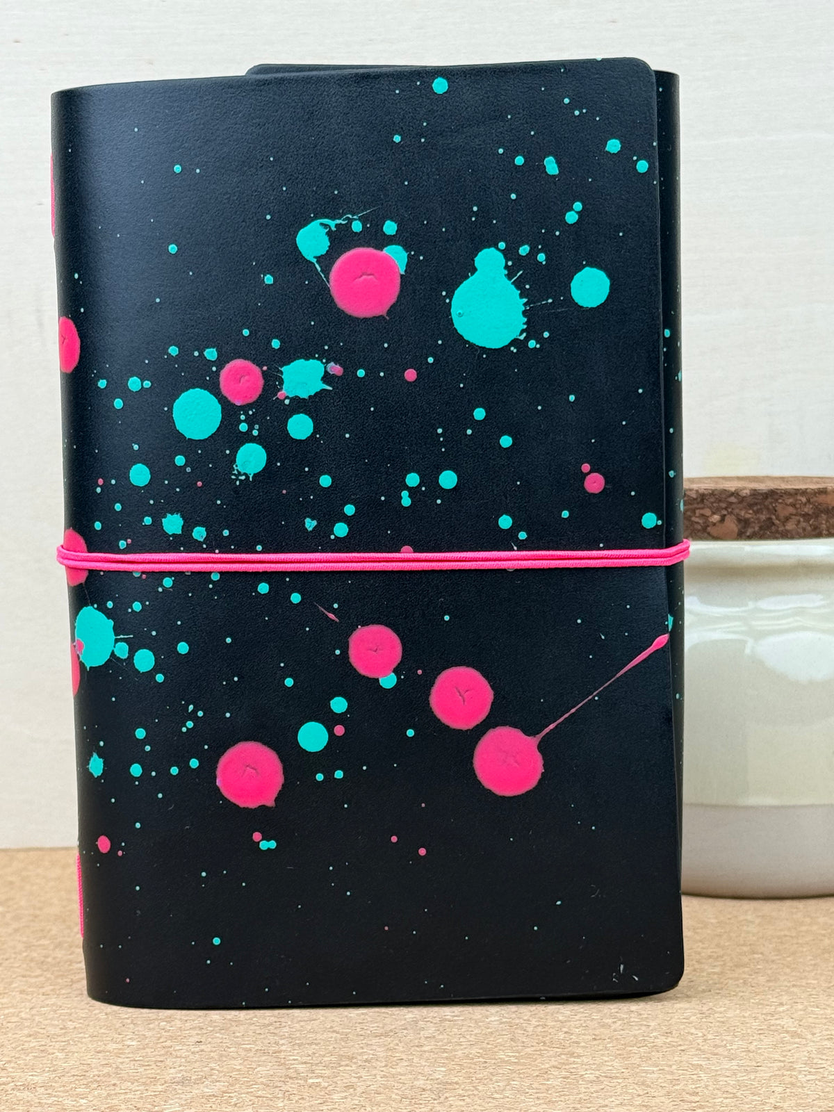 Imperfect Concepts Ollie Leather Notebook - B6 Trifold Raven Painted - Neon Pink Band