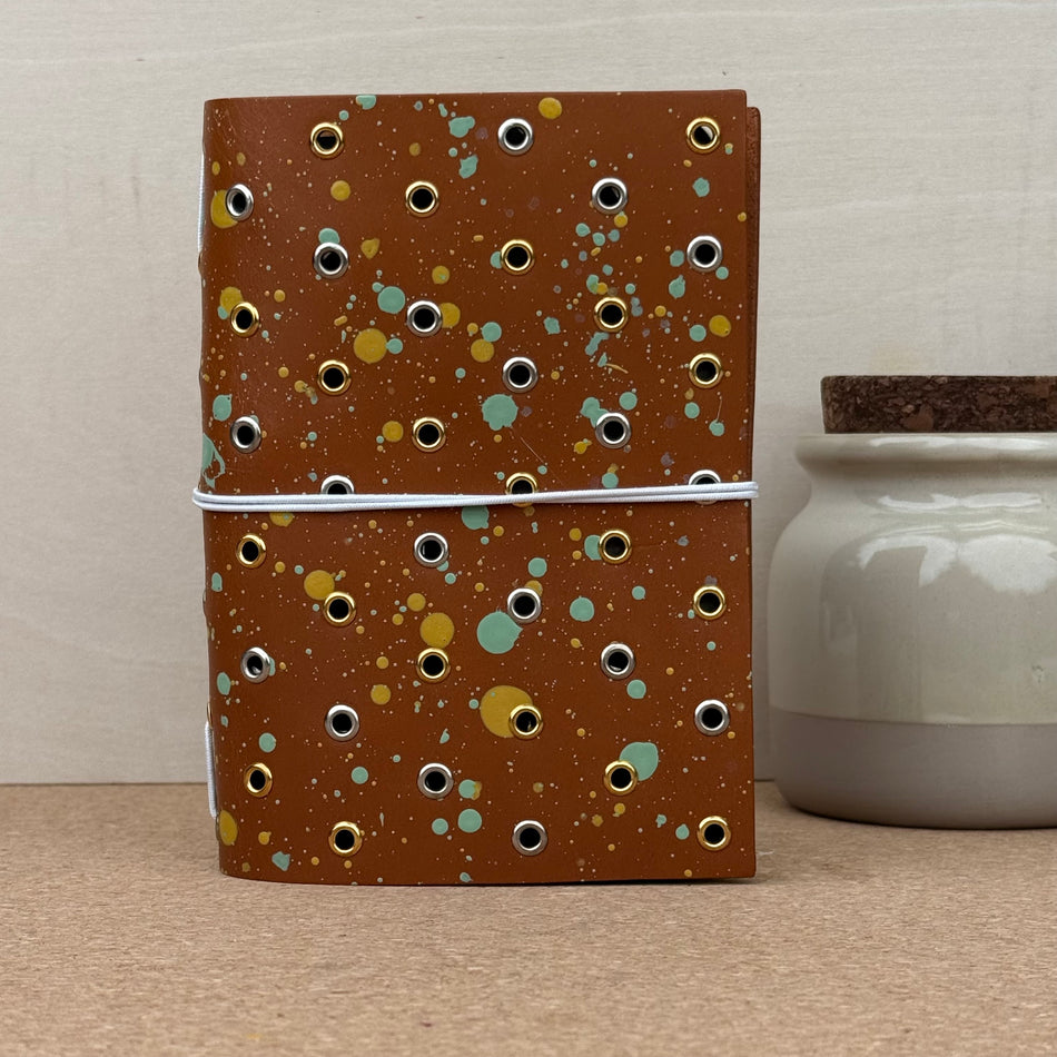 Imperfect Concepts Max Notebook - A6 Bifold - Painted Cognac w/ Mixed Grommets