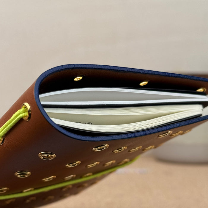 Imperfect Concepts Max Notebook - A6 Bifold - Cognac w/ Gold Grommets and Painted Edge