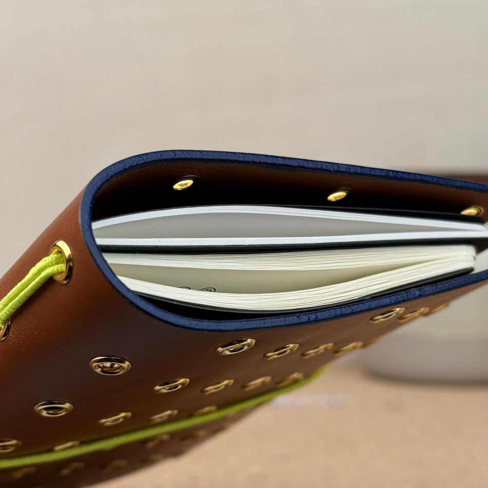 Imperfect Concepts Max Notebook - A6 Bifold - Cognac w/ Gold Grommets and Painted Edge