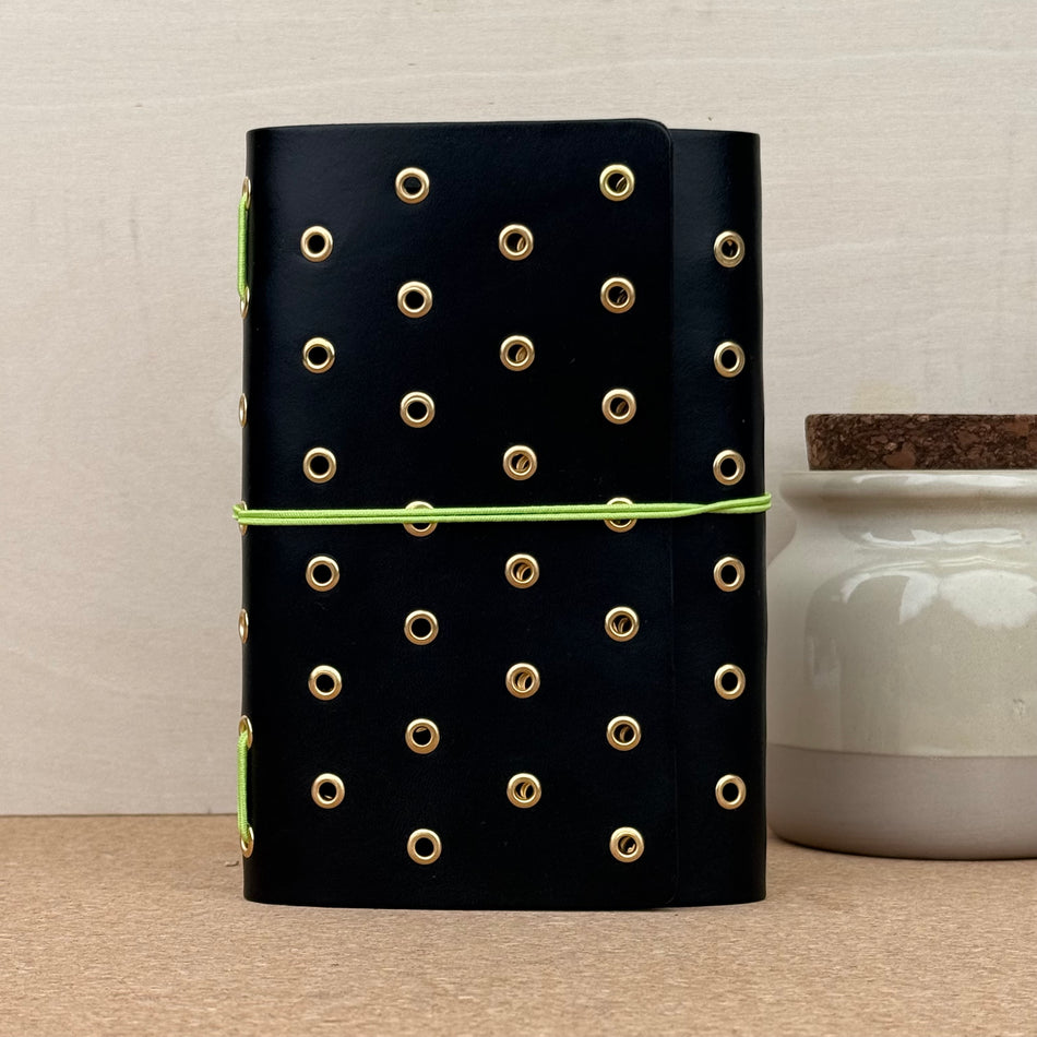 Imperfect Concepts Juniper Notebook - A6 Trifold - Raven w/ Gold Grommets