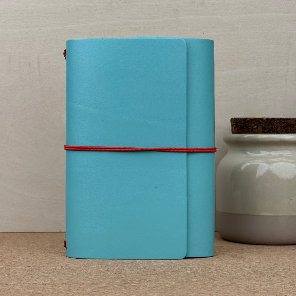 Imperfect Concepts Jasper Notebook - A6 Trifold - Turquoise w/ Red Band