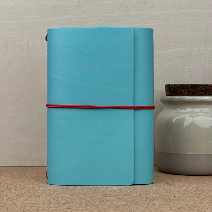 Imperfect Concepts Jasper Notebook - A6 Trifold - Turquoise w/ Red Band
