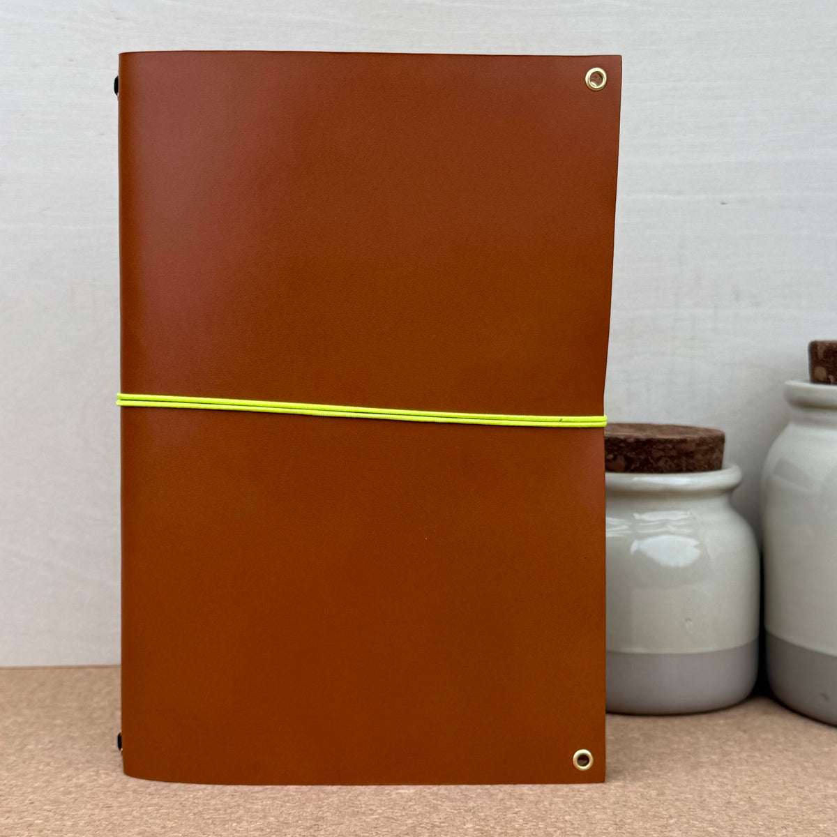 Imperfect Concepts Baxter Notebook - A5 Bifold - Cognac w/ Gold Grommet Accents